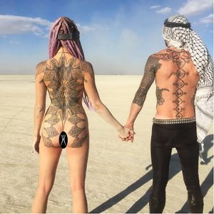 #relationshipgoals! Tattooist Kenji Alucky, photo from Kenji's Instagram @black_ink_power #tattooedcouple #blackwork #blckwrk #geometry #mandala #backpiece
