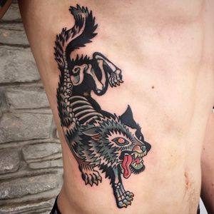 Skeletal Wolf Tattoo by Ian Bederman #animaltattoo #traditionalanimal #traditional #wolf #skeleton #quirkytattoos #IanBederman