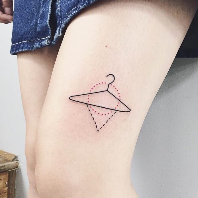 Forearm tattoo of a hanger