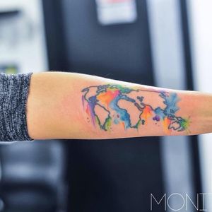 Watercolor added to a pre-existing map tattoo by Monica Gomes #maptattoo #map #colourfultattoo #worldtattoo #forearmtattoo #watercolourtattoo #watercolor #femaletattooer #monicagomes #monitattoo