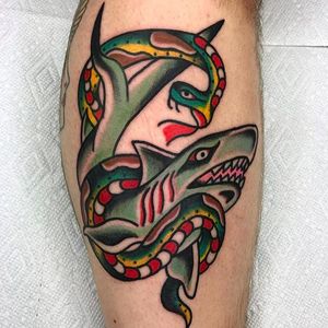 Shark vs. snake. Solid and clean tattoo by Aldo Rodriguez. #AldoRodriguez #GrandUnionTattoo #traditionaltattoo #boldtattoos #shark #snake