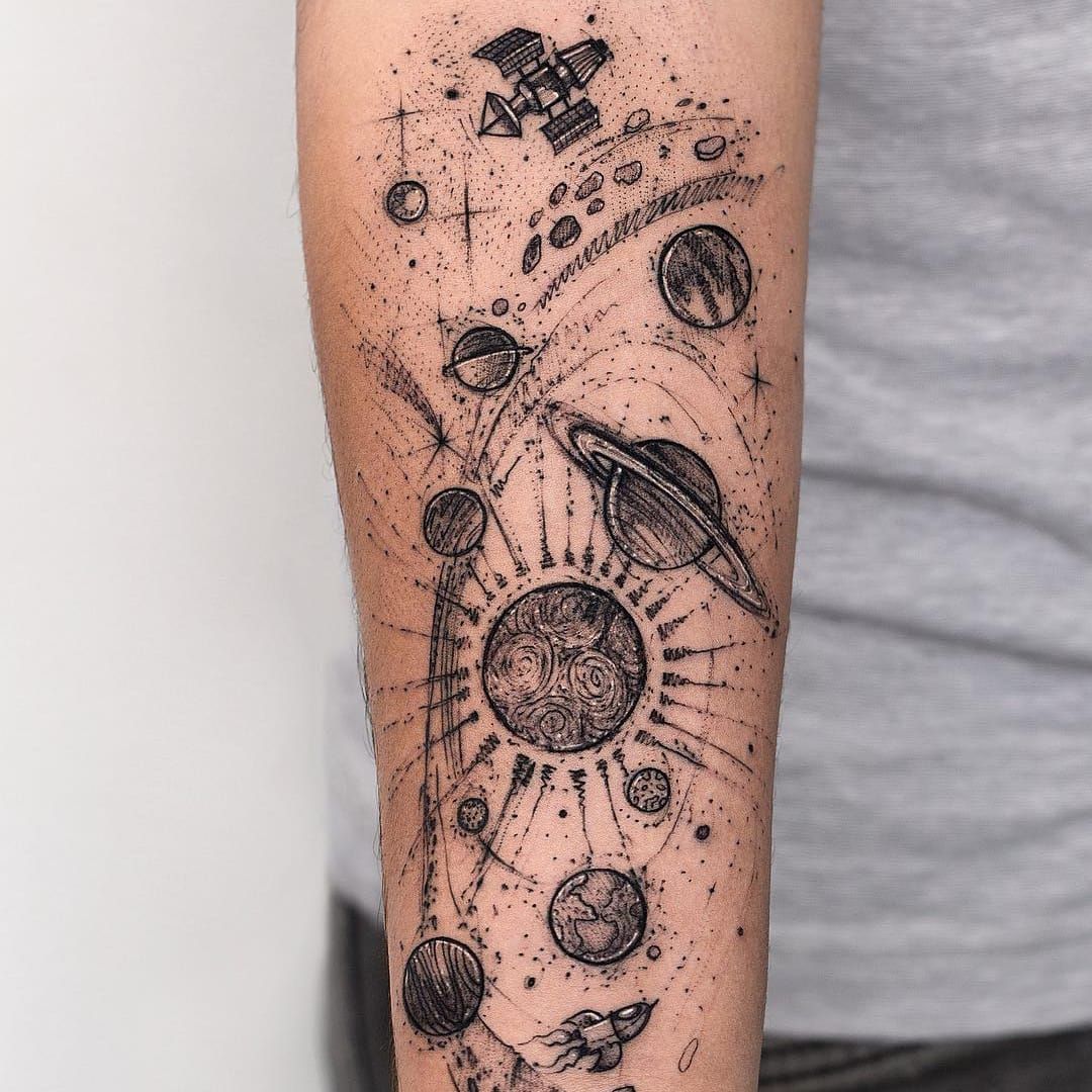Tiny minimalistic universe tattoo located on the ankle