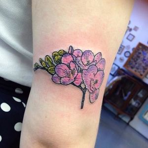 Pink and purple freesia tattoo by Ruth Rollin. #neotraditional #flower #botanical #freesia #RuthRollin