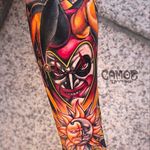 Insane looking jester tattoo by Camoz. #camoz #coloredtattoo #jester