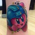 This fun mashup of Kirby and Mega Man was tattooed at Good Egg Studios. (Via IG - goodeggstudios) #kirby #megaman