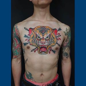 Brutal looking tiger head tattoo by HIRO. #hiro #tiger #traditional #tattoo