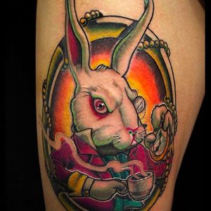 The white rabbit! An awesome looking vibrant tattoo by Camoz. #camoz #coloredtattoo #aliceinwonderland #whiterabbit