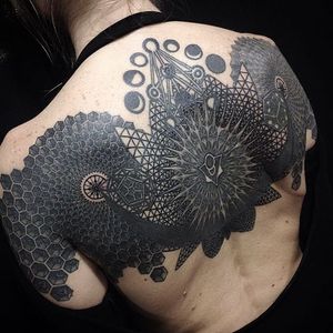 Intricate back tattoo by Anich Andrew. #AnichAndrew #backpiece #geometric #blackwork #mechanic #geometry