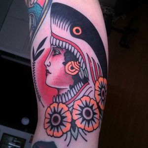 Cool and vibrant girl head with shark cowl. Creative tattoo by El Carlo. #ElCarlo #ElCarloTattoos #boldtattoos #surreal #girl #shark #blossoms