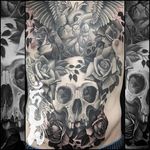 Intense black and grey back-piece by Steve Morante (IG—steve_h_morante). #backpiece #blackandgrey #heart #realism #roses #skull #SteveMorante #versatility