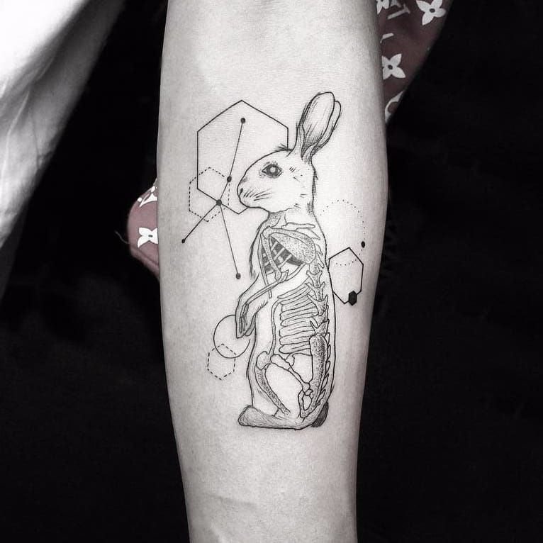 Polygonal rabbit tattoo on the Achilles heel