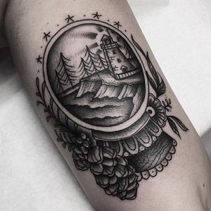 Black and grey snow globe tattoo by Cheyenne Gauthier. #traditional #blackandgrey #CheyenneGauthier #snowglobe #globe #sea #pinecone #flower