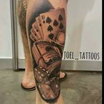 Dice, cash and cards, awesome realistic tattoo done by Joel Speelman. #JoelSpeelman #blackandgray #realistic