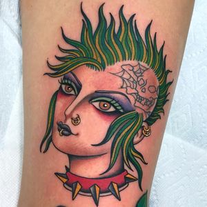 Punk lady head tattoo by Shaun Topper #ShaunTopper #ladyheadtattoo #color #portrait #punk #studs #spikes #rockandroll #musictattoo #skull #spiderweb #jewelry #mohawk #eyes #tattoooftheday