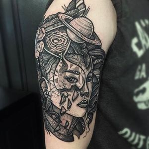 Stunning upper arm girl head tattoo done by Paul Davies. #pauldavies #blacktattoo #illustrativetattoo #geometrictattoo #dotstolines #girl #galactic #tempusfugit #timeflies