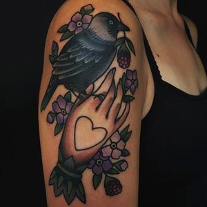 Raven, purple flowers and tattooed hand tattoo by Moira Ramone #moiraramone #neotraditional #traditional #25toLife #rotterdam #purple #raven #crow #hand