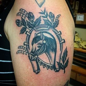 Black and grey horse and horse shoe tattoo by Nick Rutherford. #traditional #NickRutherford #tattooflash #horse #horseshoe #blackandgrey