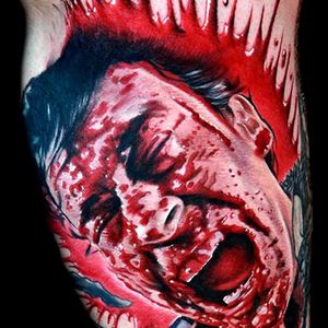 A gory moment when Ash cuts his own hand off with a chainsaw tattoo by Cecil Porter #ashwilliams #evildead #demons #gore #horrortattoo