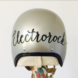 A motorcycle helmet painted with script by Tina Fino (IG—tina_fino). #signpainting #tattooinspired #TinaFino