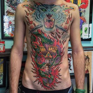 A colorful traditional torso piece done by Heinz. Via Instagram heinztattooer #traditional #snake #torch #tiger #colorful #heinztattooer #largescale