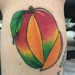 Juicy mango tattoo by Harper Cantrell. #neotraditional #mango #fruit #HarperCantrell