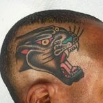 Panther head scalp tattoo by Jason Ochoa. Clean and solid work!#JasonOchoa #GreenPointTattooCo #traditionaltattoo #boldtattoos #panther #pantherhead