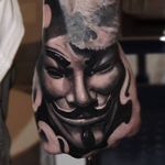 Guy Fawkes mask hand tattoo by Mads Thill. #handtattoo #blackandgrey #anonymous #guyfawkesmask #MadsThill