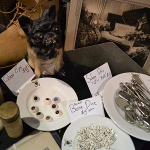 Glass eyes, animal bone dice and vintage funeral photography among other things at the Obscura Antiques booth at the Philadelphia Tattoo Arts Convention. (photo by Katie Vidan) #obscuraantiques #oddities #philadelphiatattooconvention