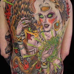 A back-piece by Valerie Vargas featuring one of her signature sorceresses (IG-valeriemodernclassic). #backpiece #griffin #sorceress  #traditional #ValerieVargas