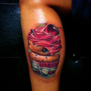 Cupcake with a cherry on top rubber ducky tattoo by Steven Compton. #newschool #rubberduck #StevenCompton #rubberducky #cherry #cupcake