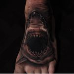 Hungry shark tattoo by James Strickland. #realism #blackandgrey #JamesStrickland #shark #foottattoo