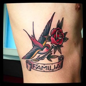 Familia swallow tattoo by @Capratattoo #Capratattoo #traditional #black #red #SkullfieldTattoo #swallow #bird #Familia