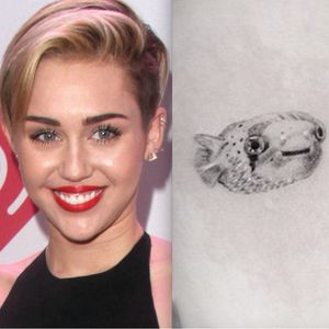 Miley Cyrus and her puffer fish tattoo. #MileyCyrus #pufferfish #celebrity #celebritytattoos