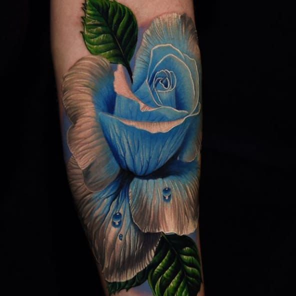 Realistic Blue Rose and Illustrated hand by Eddie Zavala TattooNOW