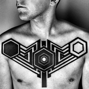 A futuristic blackwork chest-piece by Ben Volt (IG—benvolt). #abstract #avantgarde #BenVolt #bold #blackwork #experimental #geometric #minimalist #ornamental