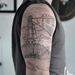 Linework lighthouse tattoo with Asking Alexandria lyrics. Tattoo by Harry Plane. #linework #blackwork #lighthouse #sea #shoreline #AskingAlexandria #lyrics #lettering #HarryPlane