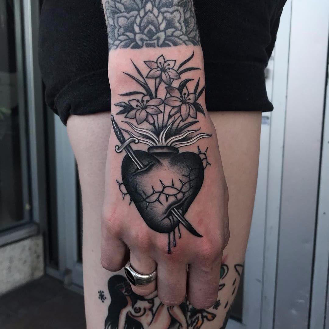 Tattoo uploaded by Tattoodo • Sacred Heart full of flowers by Javier  Betancourt #javierbetancourt #blackandgrey #oldschool #sacredheart #fire  #flowers #sword #thorns #heart #whiteink #tattoooftheday • Tattoodo