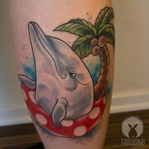 Dolphin chilling in a pool float. Tattoo by Rebecca Bertelwick. #dolphin #poolfloat #palmtree #neotraditional #RebeccaBertelwick