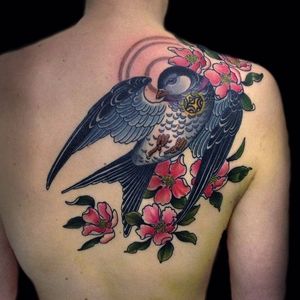 Swallow Tattoo by Rakov Serj #NeoTraditional #NeoTraditionalTattoos #RussianTattoo #ModernTattoos #ExcitingTattoos #bird #flower #RakovSerj