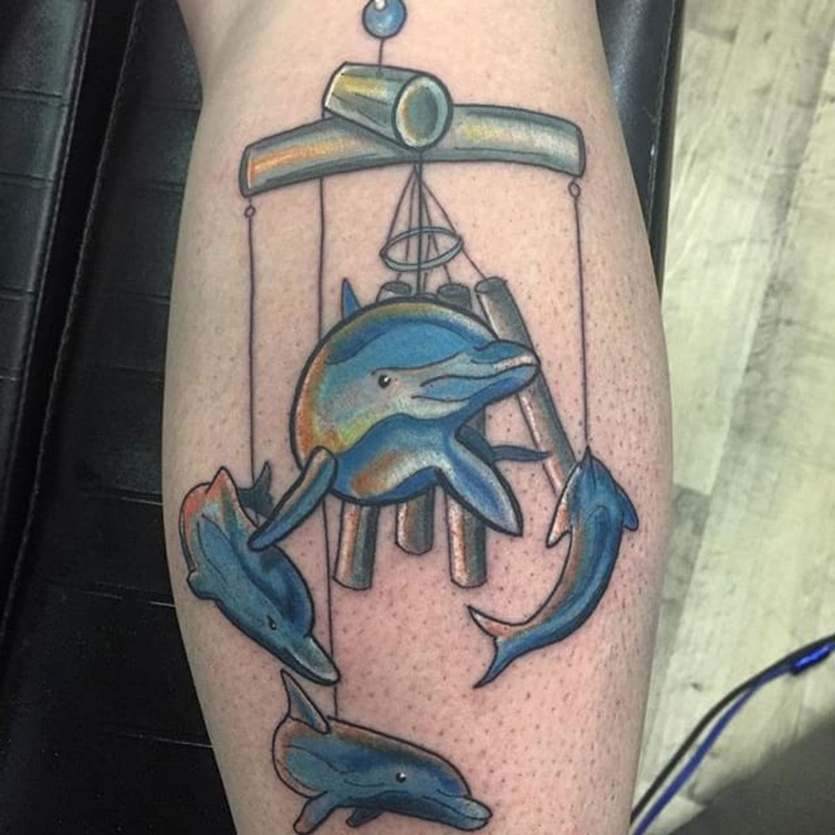 Tattoo uploaded by Stacie Mayer • Dolphin wind chime tattoo by Scott