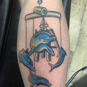Dolphin wind chime tattoo by Scott Johnson. #neotraditional #dolphin #windchime #ScottJohnson