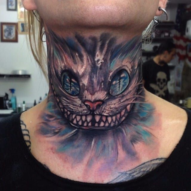 Cat tattoo on the right shoulder.