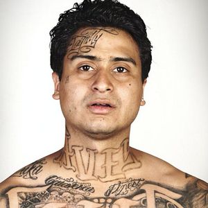 A photo by Steve Burton of a gang member with tattoos. #gangtattoos #photography #Photoshop #SkinDeep #SteveBurton #tattooremoval
