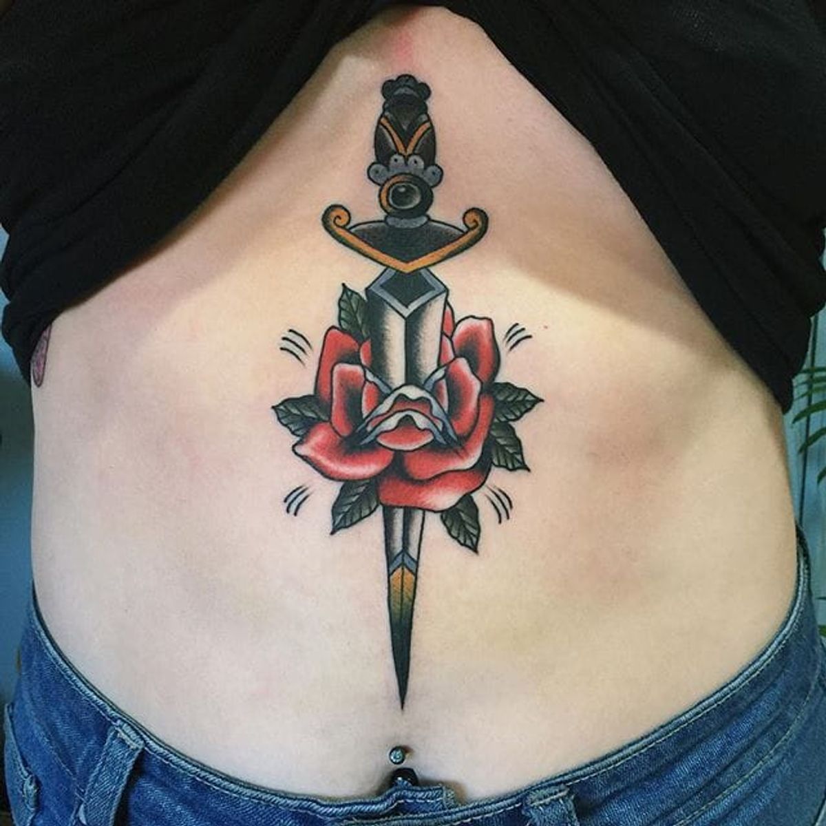 Tattoo uploaded by Stacie Mayer • Dagger and rose sternum tattoo by