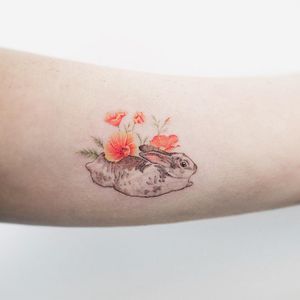 Bunny tattoo by Sol Tattoo #SolTattoo #bunnytattoo #watercolor #painterly #illustrative #linework #fineline #realistic #bunny #rabbit #flowers #poppies #nature #animal