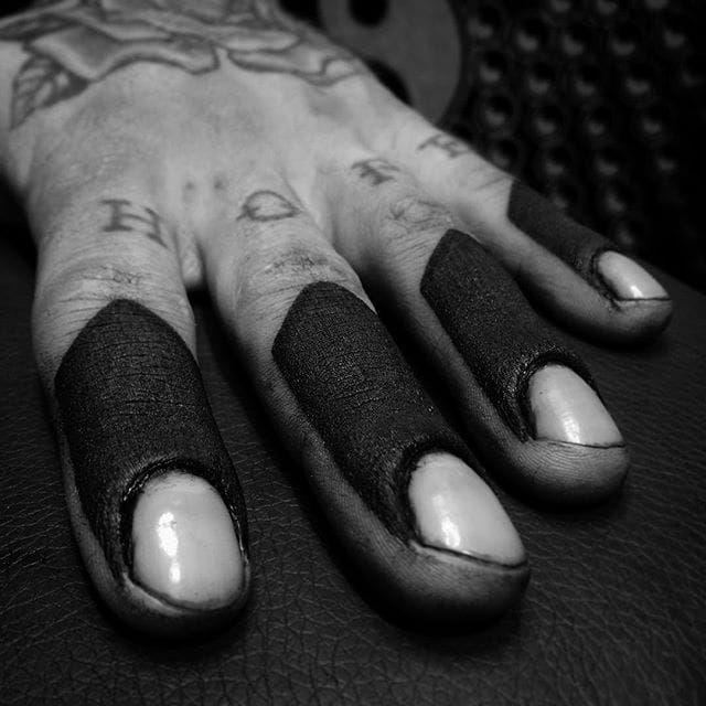 Black traditional style small tattoos on fingers  Small finger tattoos Finger  tattoos Finger tattoo designs
