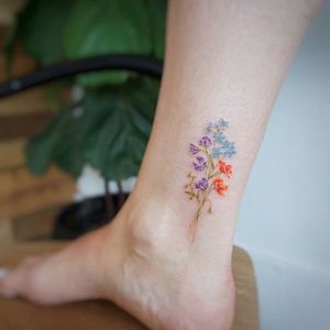 Posy tattoo by Tattooist G. NO. #TattooistGNO #GNO #GNOtattoo #fineline #pastel #watercolor #microtattoo #flower #posy