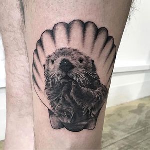 Otter and seashell tattoo by Jody Knight. #blackandgrey #otter #realism #shell #seashell #JodyKnight
