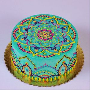 Sweet and Bright Buttercream Mandala Tattoo-inspired Cake Art from CakeCentral.com #ButterCream #Mandala #CakeDesign #CakeArt #CakeCentral