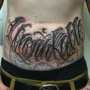 'Unsinkable' lettering stomach tattoo by Anrijs Straume. #lettering #wording #blackandgrey #blackwork #AnrijsStraume